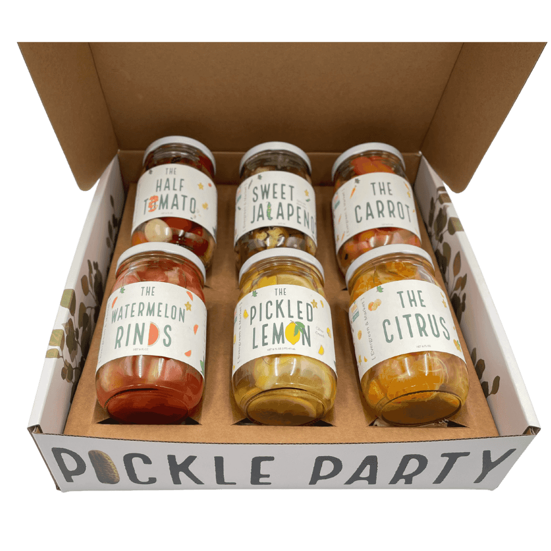 Pickle Party box holding six jars, including The Watermelon Rinds, The Pickled Lemon, The Citrus, The Carrot and Sweet Jalapeño