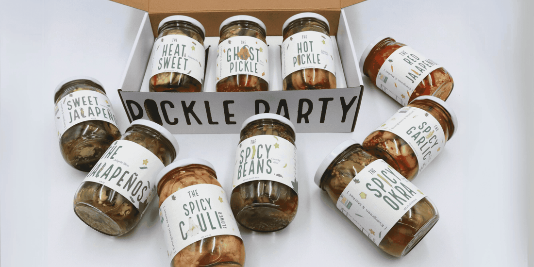 Pickle Party box of jars surrounded by more jars, including The Heat Sweet, The Ghost Pickle, The Hot Pickle and Spicy Okra