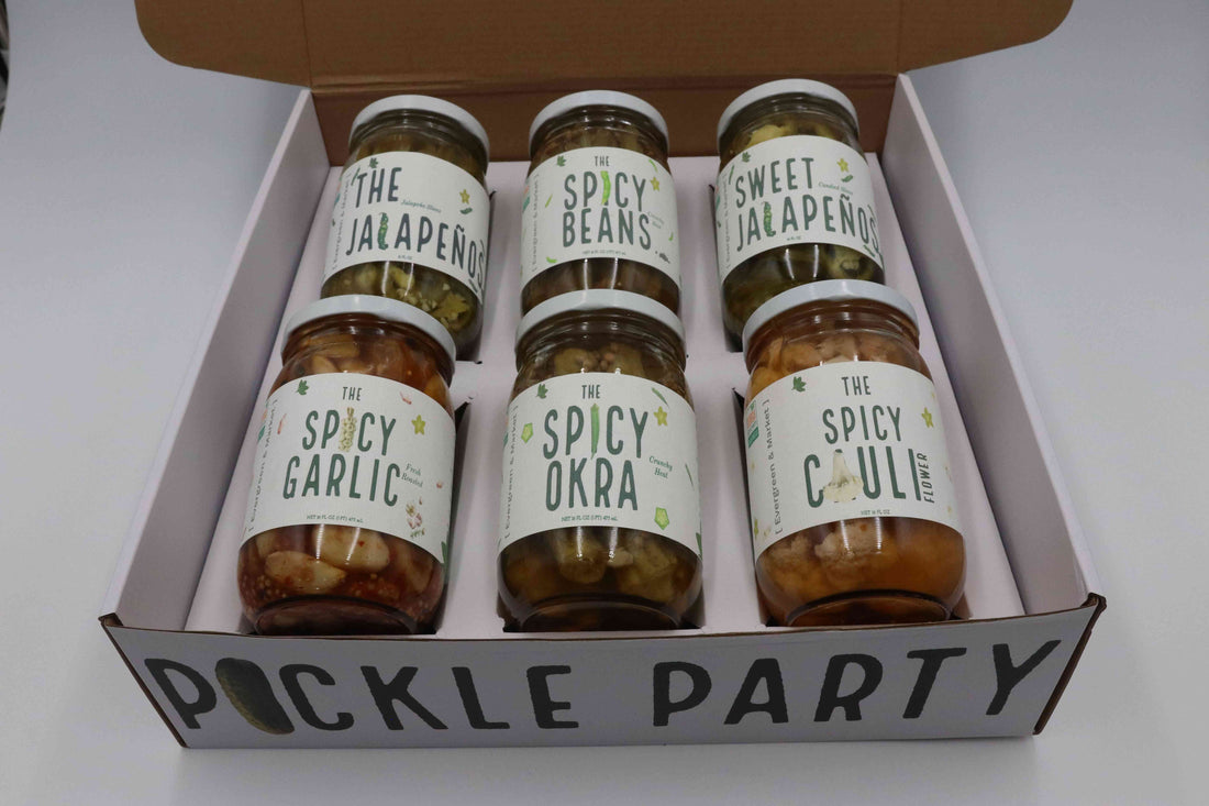 Pickle Party box holding six jars: The Jalapeño, Spicy Beans, Sweet Jalapeño, Spicy Garlic, Spicy Okra and Spicy Cauli