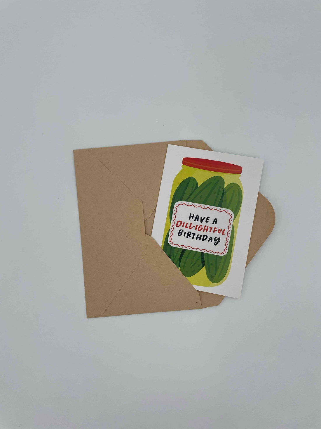 Have a Dill-ightful Birthday card with a pickle jar, on a kraft envelope