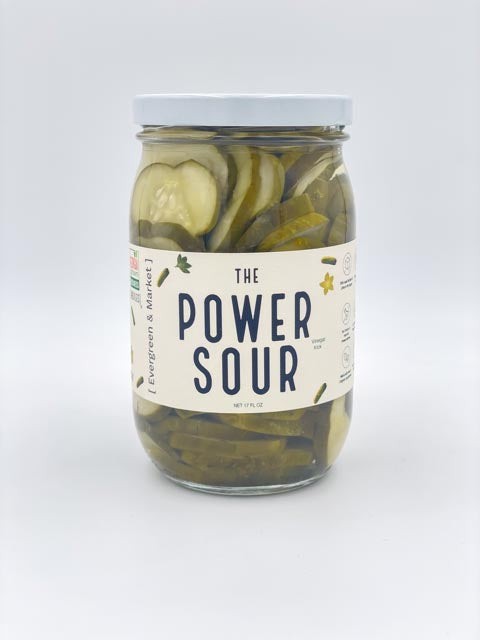 The Power Sour pickles in glass jar