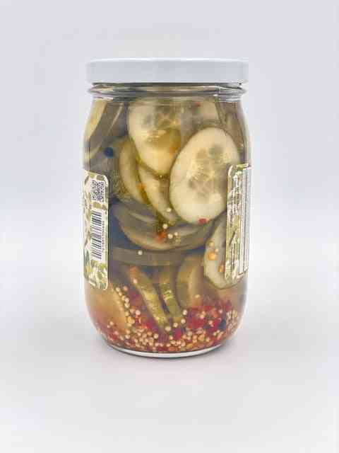 The Hot Pickle jar side view, pickles and spices visible