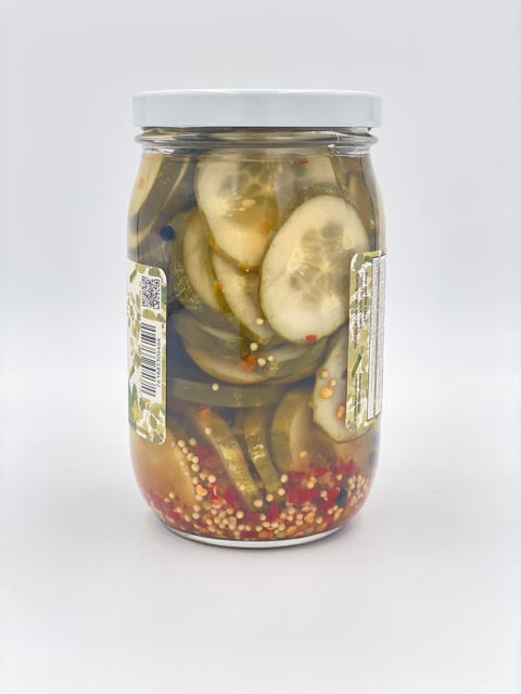 The Hot Pickle jar side view, pickles and spices visible